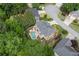 A high-angle view of the property and neighborhood. Featuring a large pool and verdant tree coverage at 6317 Benbrooke Overlook Nw, Acworth, GA 30101