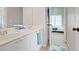Bathroom with double vanity and a view into the adjacent bedroom at 6317 Benbrooke Overlook Nw, Acworth, GA 30101