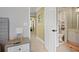 Well-lit bathroom with a white vanity and a view to the hallway at 6317 Benbrooke Overlook Nw, Acworth, GA 30101
