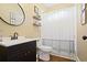 Well-lit bathroom with vanity, toilet, and shower/tub combination at 6317 Benbrooke Overlook Nw, Acworth, GA 30101