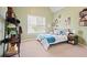 Comfortable bedroom featuring a window, a bed with a blue comforter, and shelving at 6317 Benbrooke Overlook Nw, Acworth, GA 30101