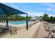 Enjoy the community pool, furnished with lounge chairs, tables, and sunshades for resident relaxation at 6317 Benbrooke Overlook Nw, Acworth, GA 30101