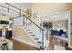 Spacious foyer showcasing high ceilings, staircase with white railings, and view to office at 6317 Benbrooke Overlook Nw, Acworth, GA 30101