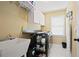 Well-organized laundry room with sink, counter space, and appliances at 6317 Benbrooke Overlook Nw, Acworth, GA 30101