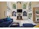Bright living room with a fireplace, built-in shelving, and a comfortable seating area, perfect for Gathering gatherings at 6317 Benbrooke Overlook Nw, Acworth, GA 30101