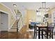 Inviting living area with hardwood floors, staircase, and views into the living room at 6317 Benbrooke Overlook Nw, Acworth, GA 30101