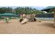Community playground with swings, slides, and climbing structures set on a wood chip surface at 6317 Benbrooke Overlook Nw, Acworth, GA 30101
