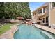 Beautiful backyard pool, patio, and outdoor seating, perfect for relaxing or entertaining at 6317 Benbrooke Overlook Nw, Acworth, GA 30101
