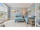 Comfortable sitting room with large windows, blue couches, and decorative rug at 6317 Benbrooke Overlook Nw, Acworth, GA 30101