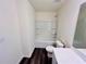 White bathroom featuring a shower-tub combo and a matching toilet at 7775 Sudbury Cir, Covington, GA 30014