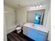 Bathroom with modern vanity, white cabinets, and tile flooring at 7775 Sudbury Cir, Covington, GA 30014