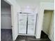 This bathroom includes a glass enclosed shower and a large closet with shelving at 7775 Sudbury Cir, Covington, GA 30014