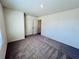 Bedroom with plush carpet, white walls, and a double door closet at 7775 Sudbury Cir, Covington, GA 30014