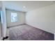 Bedroom features plush carpeting, white walls, and a window with blinds at 7775 Sudbury Cir, Covington, GA 30014