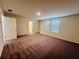 Large bedroom with gray carpet, two windows and ensuite bathroom view at 7775 Sudbury Cir, Covington, GA 30014