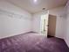 Large walk-in closet with wall-mounted shelving and plush, patterned carpeting at 7775 Sudbury Cir, Covington, GA 30014