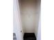 Walk-in closet with a white wire shelf and dark wood-look flooring at 7775 Sudbury Cir, Covington, GA 30014
