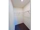 A simple walk-in closet space with a shelf for organized storage at 7775 Sudbury Cir, Covington, GA 30014