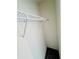 Storage closet with a wire rack shelf for hanging or folded clothing at 7775 Sudbury Cir, Covington, GA 30014