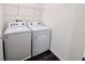 Laundry area features a new washer and dryer set for convenient chores at 7775 Sudbury Cir, Covington, GA 30014