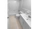 Clean, all-white bathroom with a tiled shower, toilet, and vanity for a fresh and functional space at 2060 Devore Sw Dr, Marietta, GA 30008
