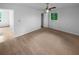 Spacious bedroom featuring carpeted floors, a ceiling fan, and an adjacent door leading to the second bedroom at 2060 Devore Sw Dr, Marietta, GA 30008