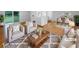 Bright living room featuring a neutral palette, hard wood flooring, a large picture window, and a dining area at 2060 Devore Sw Dr, Marietta, GA 30008