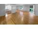 Spacious living room with hardwood floors, open layout, and view into the connected kitchen at 2060 Devore Sw Dr, Marietta, GA 30008