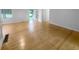 Bright living room featuring gleaming hardwood floors and an open doorway for easy access at 2060 Devore Sw Dr, Marietta, GA 30008