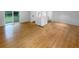 Bright living room featuring a neutral palette, hard wood flooring, and a large picture window at 2060 Devore Sw Dr, Marietta, GA 30008