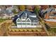 Aerial view of a luxury home with landscaped backyard, situated on a hillside at 2837 Darlington Run, Duluth, GA 30097