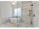 Elegant bathroom featuring soaking tub, glass shower with dual shower heads, and marble accents at 2837 Darlington Run, Duluth, GA 30097