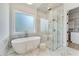 Spa-like bathroom featuring soaking tub, glass shower, and marble accents for a luxurious feel at 2837 Darlington Run, Duluth, GA 30097
