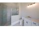 Modern bathroom with glass shower door, gold fixtures, and white vanity at 2837 Darlington Run, Duluth, GA 30097