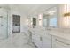 Elegant bathroom with marble floors, double vanities, and a glass-enclosed shower at 2837 Darlington Run, Duluth, GA 30097