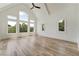Bright bedroom featuring hardwood floors, high ceilings, and large windows providing ample natural light at 2837 Darlington Run, Duluth, GA 30097