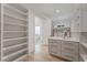 Spacious walk-in closet with custom shelving and drawers, providing ample storage space at 2837 Darlington Run, Duluth, GA 30097