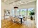 Elegant dining room boasts coffered ceiling, hardwood floors, and chandelier at 2837 Darlington Run, Duluth, GA 30097