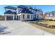 Elegant two-story home featuring a 3-car garage and meticulous landscaping at 2837 Darlington Run, Duluth, GA 30097