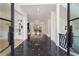 Grand foyer featuring marble floors, glass paneled double doors, and open view to living spaces at 2837 Darlington Run, Duluth, GA 30097