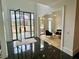 Stunning foyer with marble flooring, coffered ceilings, and glass front doors, offering an airy feel at 2837 Darlington Run, Duluth, GA 30097