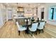 Bright eat-in kitchen features custom cabinets, marble countertops, a marble backsplash, and pendant lighting at 2837 Darlington Run, Duluth, GA 30097