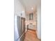 The well-equipped kitchen features custom cabinets, a stainless steel range hood, and marble backsplash at 2837 Darlington Run, Duluth, GA 30097