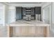 Modern kitchen with a large island, custom cabinetry and stainless steel appliances at 2837 Darlington Run, Duluth, GA 30097