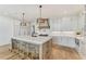 Bright kitchen featuring a large center island with marble countertops and modern appliances at 2837 Darlington Run, Duluth, GA 30097