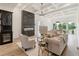 Stylish living room showcases fireplace, wet bar, coffered ceiling, and open layout at 2837 Darlington Run, Duluth, GA 30097