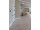 Open concept living room featuring marble floors, trim work and access to kitchen at 2837 Darlington Run, Duluth, GA 30097