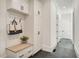Stylish mudroom with built-in bench, storage cabinets, and coat hooks for organization at 2837 Darlington Run, Duluth, GA 30097