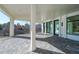 Covered back patio featuring decorative brick, large columns, and an outdoor view at 2837 Darlington Run, Duluth, GA 30097