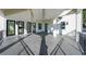 Covered patio features black framed windows, a grey tiled floor, and black metal railings at 2837 Darlington Run, Duluth, GA 30097